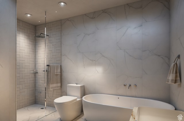 bathroom with toilet, tile walls, and plus walk in shower