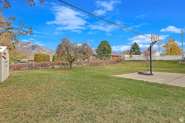 4866 Adams Ave, South Ogden, UT 84403 - view of yard featuring a mountain view and basketball court