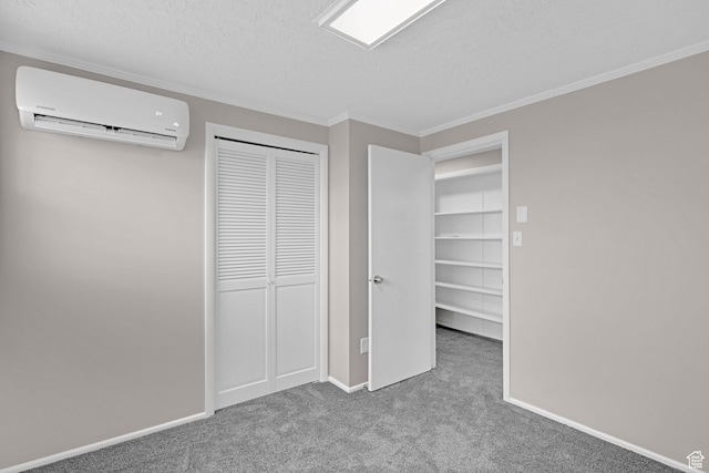 4866 Adams Ave, South Ogden, UT 84403 - unfurnished bedroom with a wall unit AC, crown molding, carpet floors, a textured ceiling, and a closet