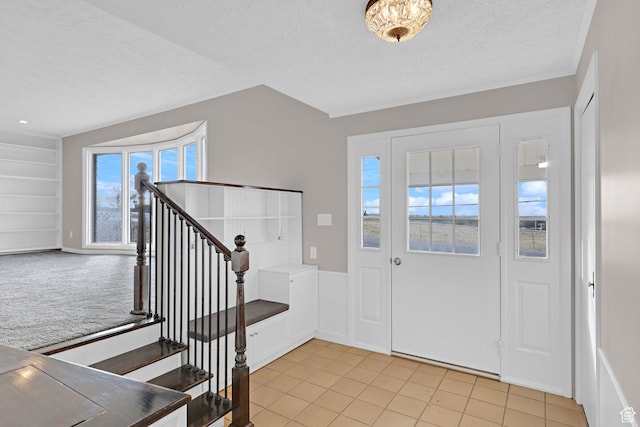 4866 Adams Ave, South Ogden, UT 84403 - entrance foyer featuring light tile patterned floors and a textured ceiling