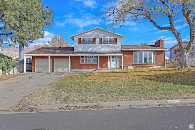 4866 Adams Ave, South Ogden, UT 84403 - view of front of house with a front lawn and a garage
