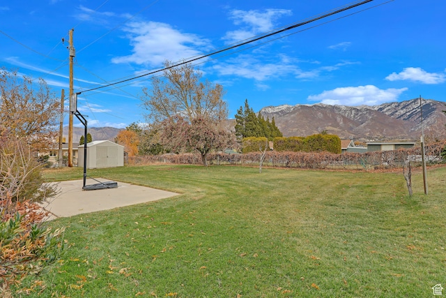 4866 Adams Ave, South Ogden, UT 84403 - view of yard with a patio area, a mountain view, and a shed