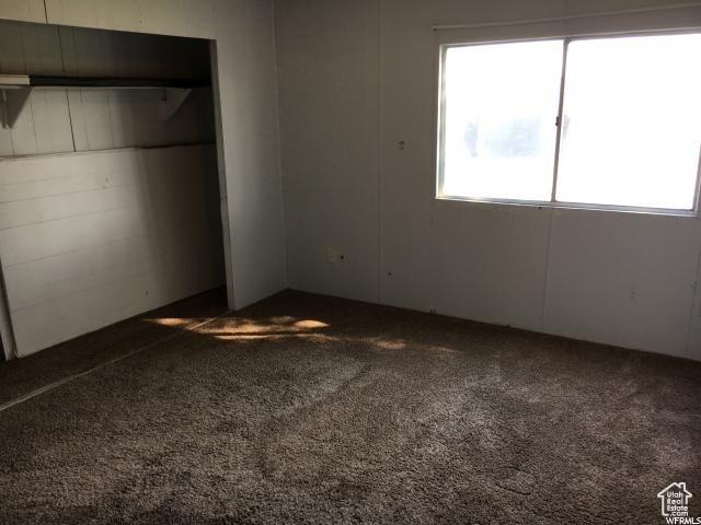 18120 N 4400 W, Fielding, UT 84311 - unfurnished bedroom with carpet floors