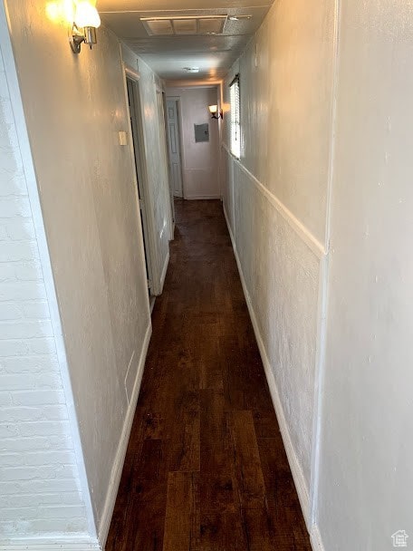 corridor featuring dark hardwood / wood-style floors