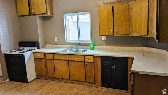 18250 N 4400 W, Fielding, UT 84311 - kitchen with electric stove, a sink, light countertops, and light wood finished floors