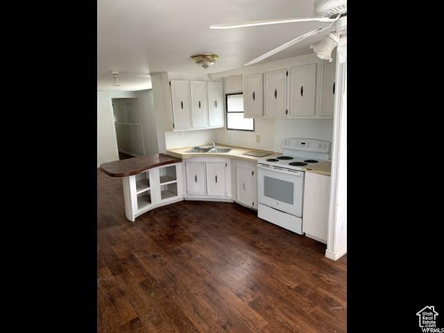 18250 N 4400 W, Fielding, UT 84311 - kitchen featuring white electric stove, white cabinetry, a sink, dark wood-style floors, and light countertops