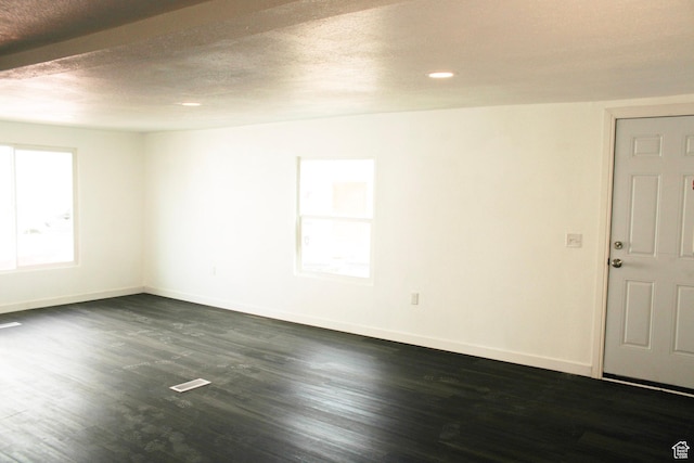 18250 N 4400 W, Fielding, UT 84311 - empty room with baseboards, dark wood-style flooring, recessed lighting, and a textured ceiling