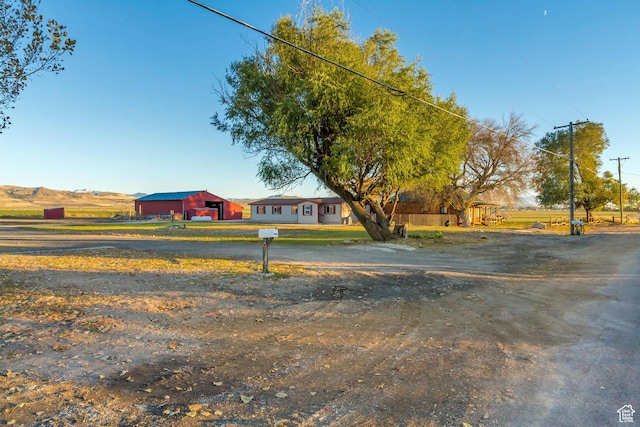 18250 N 4400 W, Fielding, UT 84311 - view of front facade with driveway and an outdoor structure