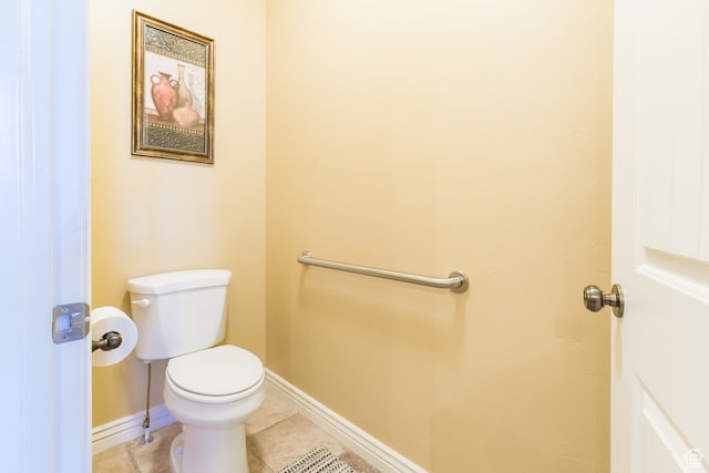 bathroom with tile patterned floors and toilet