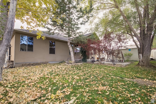 rear view of house with a lawn