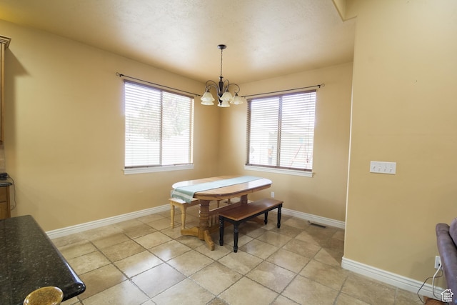 1126 S Valley View Dr W, Santaquin, UT 84655 - dining area with a chandelier, baseboards, and light tile patterned flooring