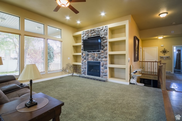carpeted living room with a healthy amount of sunlight and built in features
