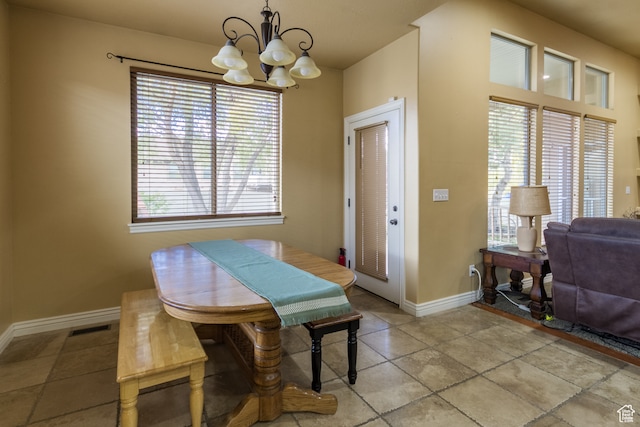 dining space featuring an inviting chandelier