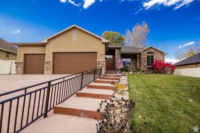 view of front of house with a front yard and a garage