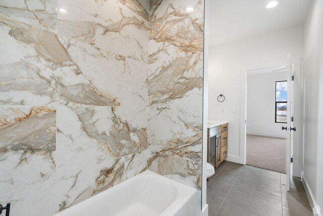 bathroom featuring recessed lighting, toilet, vanity, and tile patterned flooring