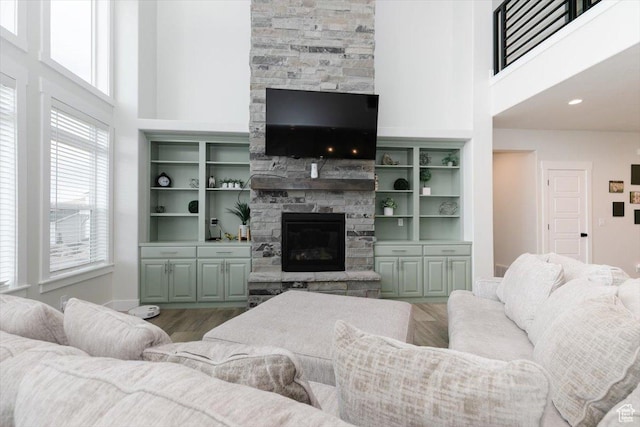615 N 750 E, Hyde Park, UT 84318 - living room featuring a high ceiling, a fireplace, and wood finished floors