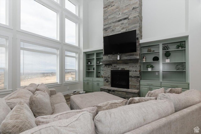 615 N 750 E, Hyde Park, UT 84318 - living area with a fireplace, a towering ceiling, and baseboards