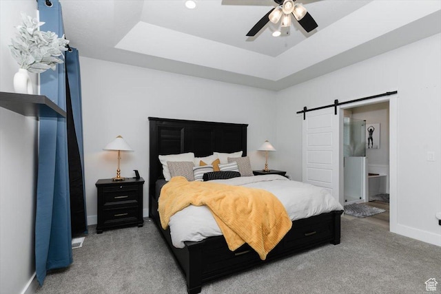615 N 750 E, Hyde Park, UT 84318 - bedroom featuring a barn door, light colored carpet, baseboards, and a raised ceiling