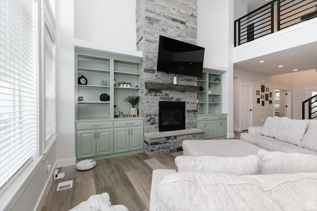 615 N 750 E, Hyde Park, UT 84318 - living area featuring a fireplace, light wood finished floors, baseboards, and a high ceiling