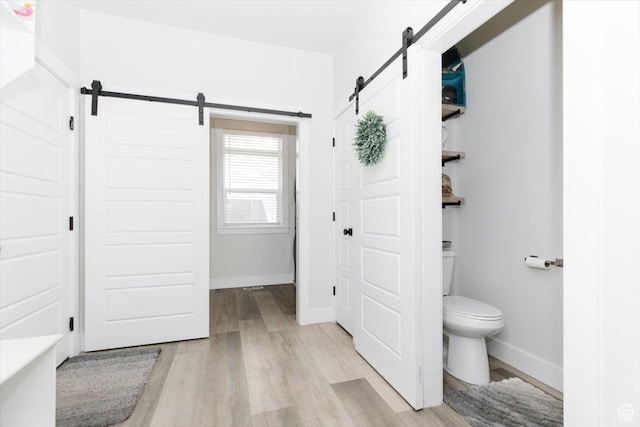 615 N 750 E, Hyde Park, UT 84318 - bathroom featuring wood finished floors, toilet, and baseboards