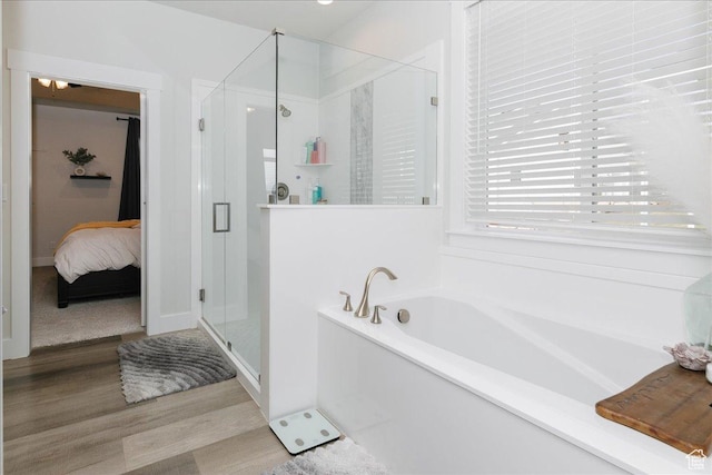 615 N 750 E, Hyde Park, UT 84318 - bathroom featuring a garden tub, a stall shower, wood finished floors, and connected bathroom