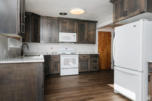 176 W 500 N, Malad City, ID 83252 - kitchen with white appliances, a sink, dark brown cabinets, dark wood-style flooring, and a textured ceiling