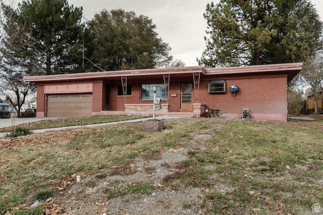 176 W 500 N, Malad City, ID 83252 - ranch-style home featuring brick siding, an attached garage, a front yard, and concrete driveway