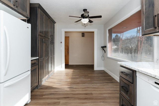 176 W 500 N, Malad City, ID 83252 - kitchen featuring white appliances, ceiling fan, dark brown cabinetry, baseboards, and light wood finished floors