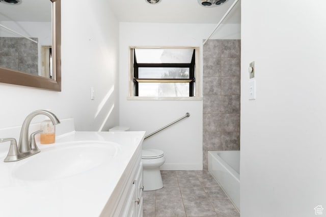 full bathroom with tile patterned floors, vanity, shower / bath combination, and toilet