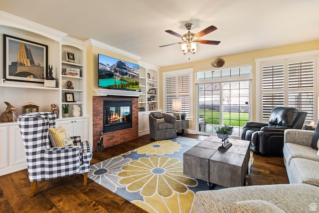 living room with built in shelves, dark hardwood / wood-style floors, and ceiling fan