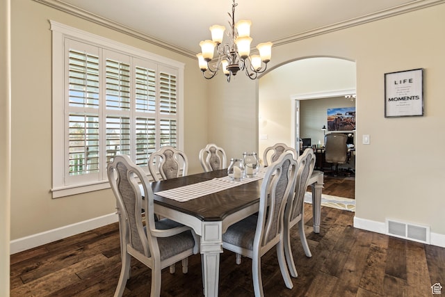 528 E 700 S Unit 4, Monroe, UT 84754 - dining room with a chandelier, dark wood finished floors, crown molding, baseboards, and arched walkways