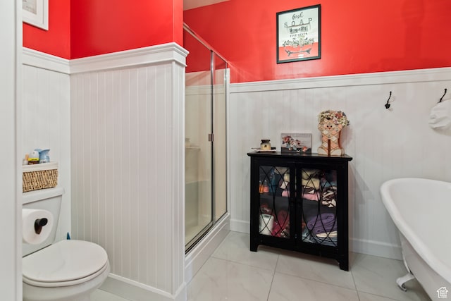 bathroom featuring toilet and separate shower and tub
