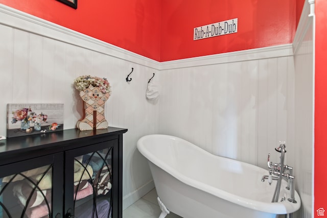 bathroom with tile patterned floors and a bathing tub