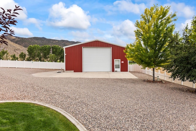 528 E 700 S Unit 4, Monroe, UT 84754 - detached garage featuring a mountain view and driveway