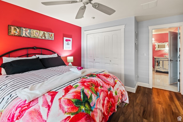 bedroom featuring ceiling fan, dark hardwood / wood-style floors, and a closet