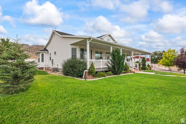 528 E 700 S Unit 4, Monroe, UT 84754 - view of front of house featuring a porch and a front lawn