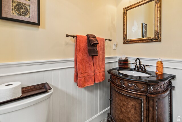 bathroom featuring vanity and toilet