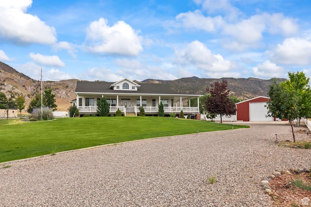 528 E 700 S Unit 4, Monroe, UT 84754 - farmhouse-style home featuring a mountain view, an outbuilding, gravel driveway, and covered porch