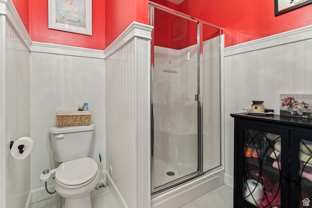 bathroom featuring an enclosed shower and toilet