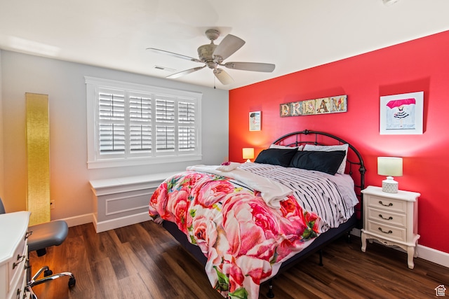 bedroom with ceiling fan and dark hardwood / wood-style flooring