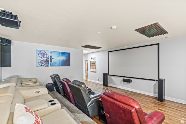 cinema room with hardwood / wood-style flooring