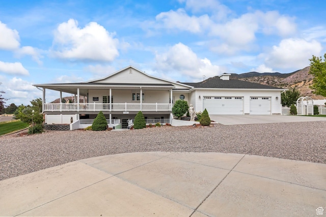 528 E 700 S Unit 4, Monroe, UT 84754 - view of front of property featuring covered porch, driveway, a garage, and a mountain view