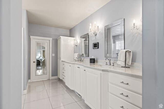 bathroom with tile patterned floors and vanity