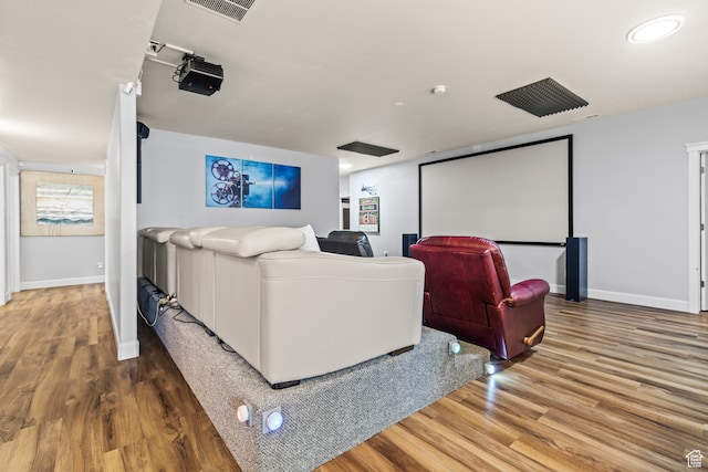 home theater featuring hardwood / wood-style floors