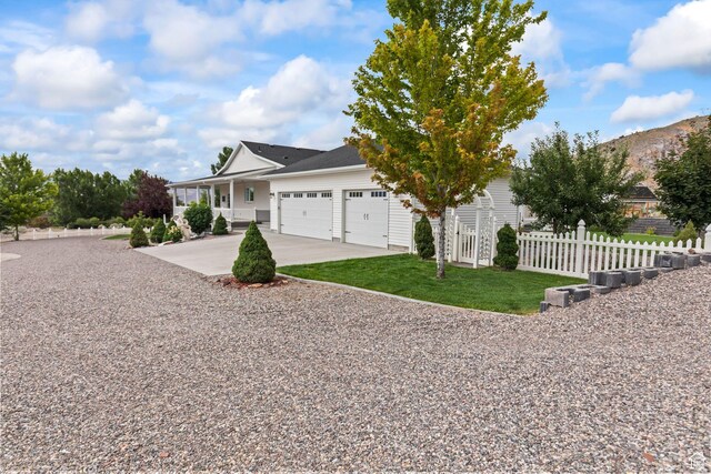 528 E 700 S Unit 4, Monroe, UT 84754 - view of front of property with concrete driveway, an attached garage, covered porch, and a mountain view