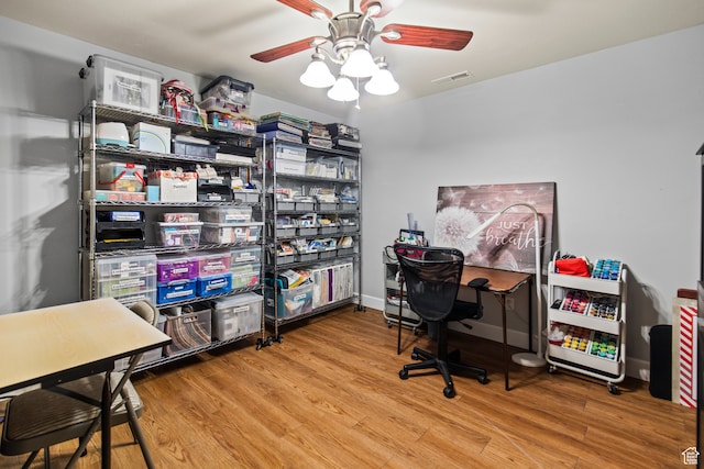 office area with hardwood / wood-style floors and ceiling fan