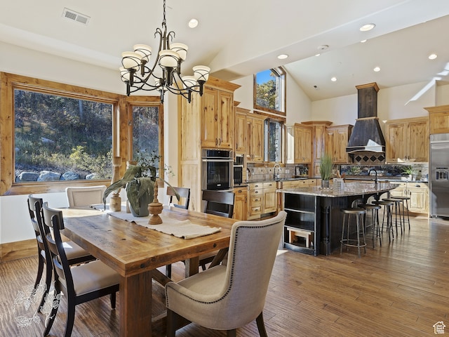 865 N Valley View Dr, Eden, UT 84310 - dining room with visible vents, high vaulted ceiling, an inviting chandelier, recessed lighting, and wood-type flooring