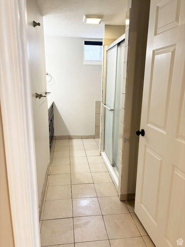341 S 3rd W, Soda Springs, ID 83276 - bathroom with tile patterned flooring, walk in shower, and a textured ceiling