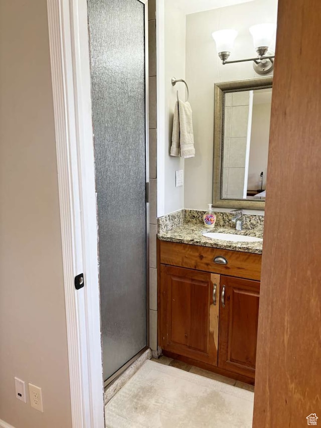 341 S 3rd W, Soda Springs, ID 83276 - bathroom featuring vanity and a shower with door