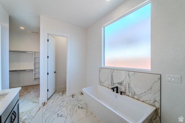 3092 E 2110th St S, St George, UT 84790 - full bathroom featuring healthy amount of natural light, a soaking tub, vanity, marble finish flooring, and recessed lighting